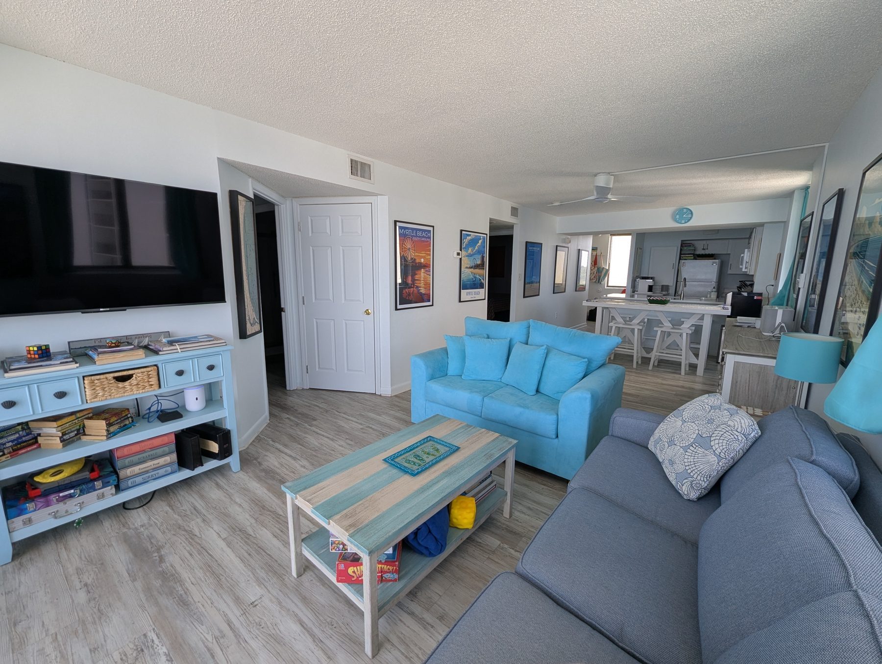 Bright open living area with ocean views at 728 Sands Beach Club corner condo