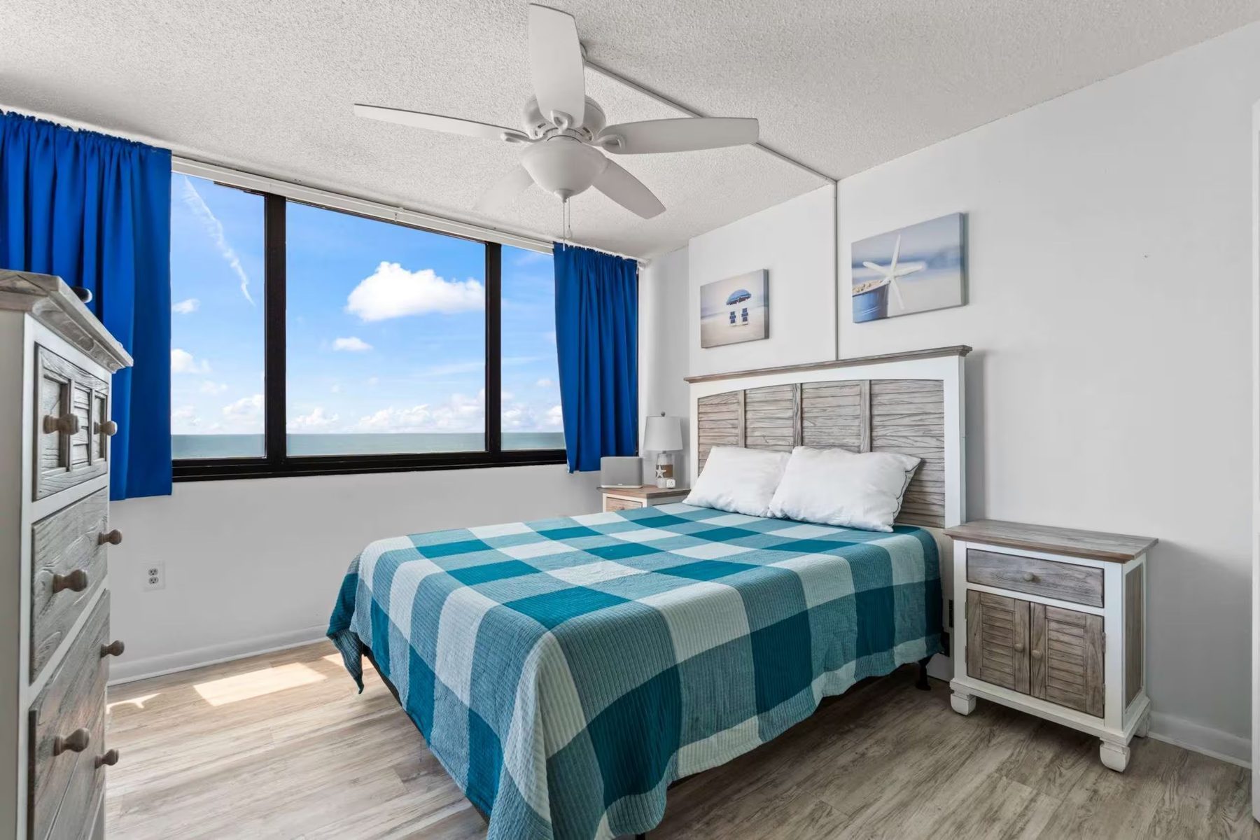 Primary bedroom with queen bed at 728 Sands Beach Club oceanfront condo